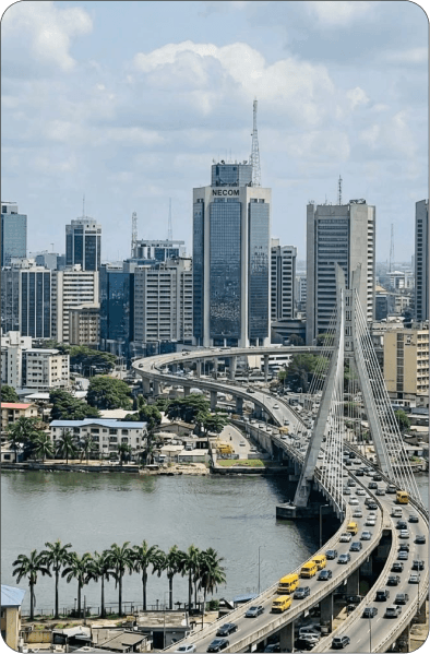 Palm-lined waterfront in a Nigerian city